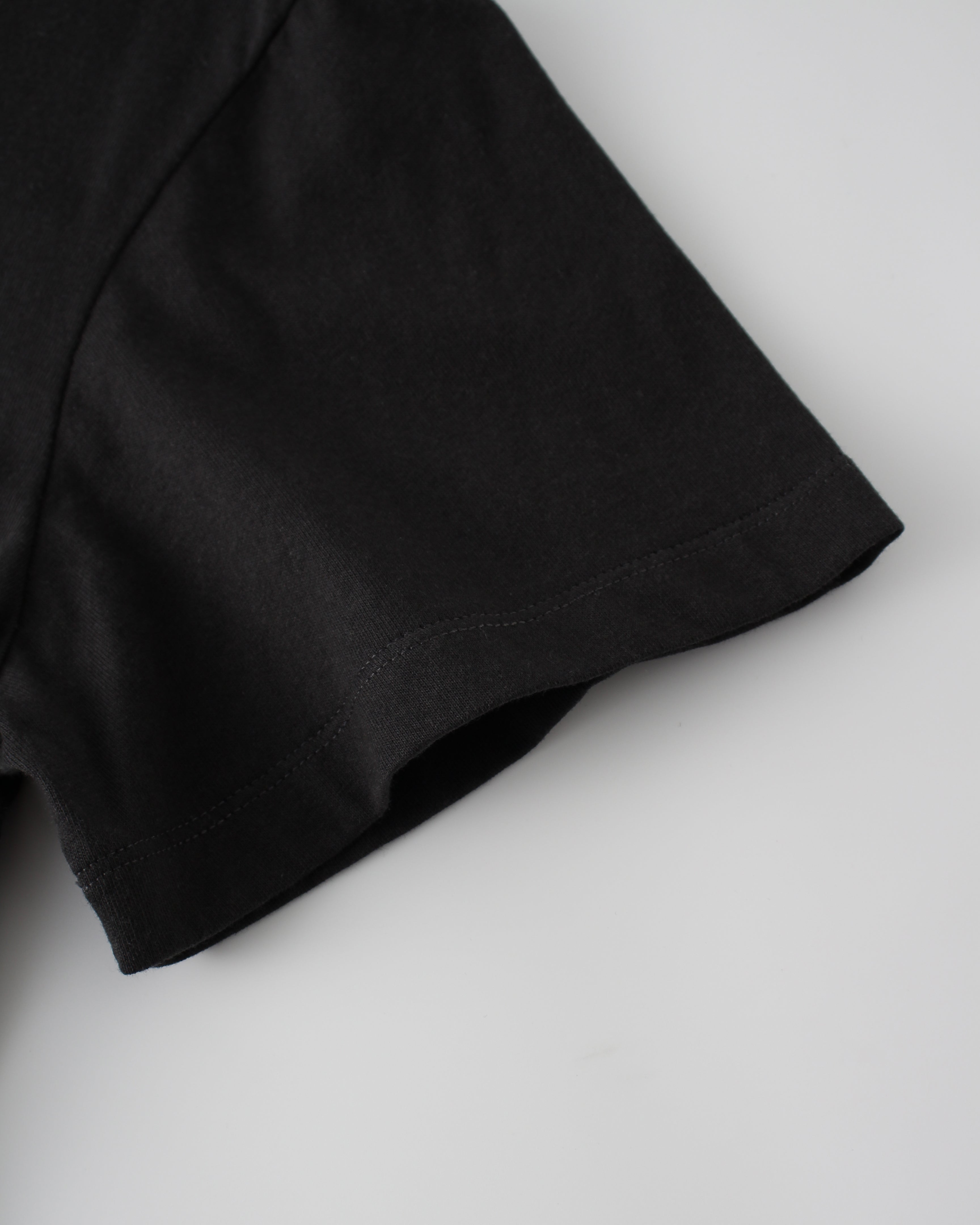 black tee sleeve on a white background