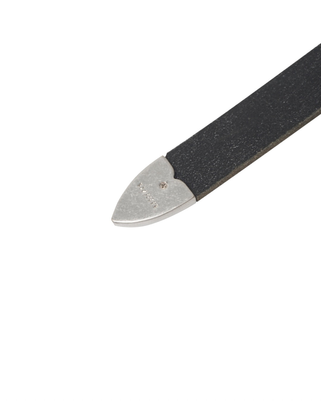 Image of a stylish black leather Western belt's metallic tips close up, placed on a white surface.