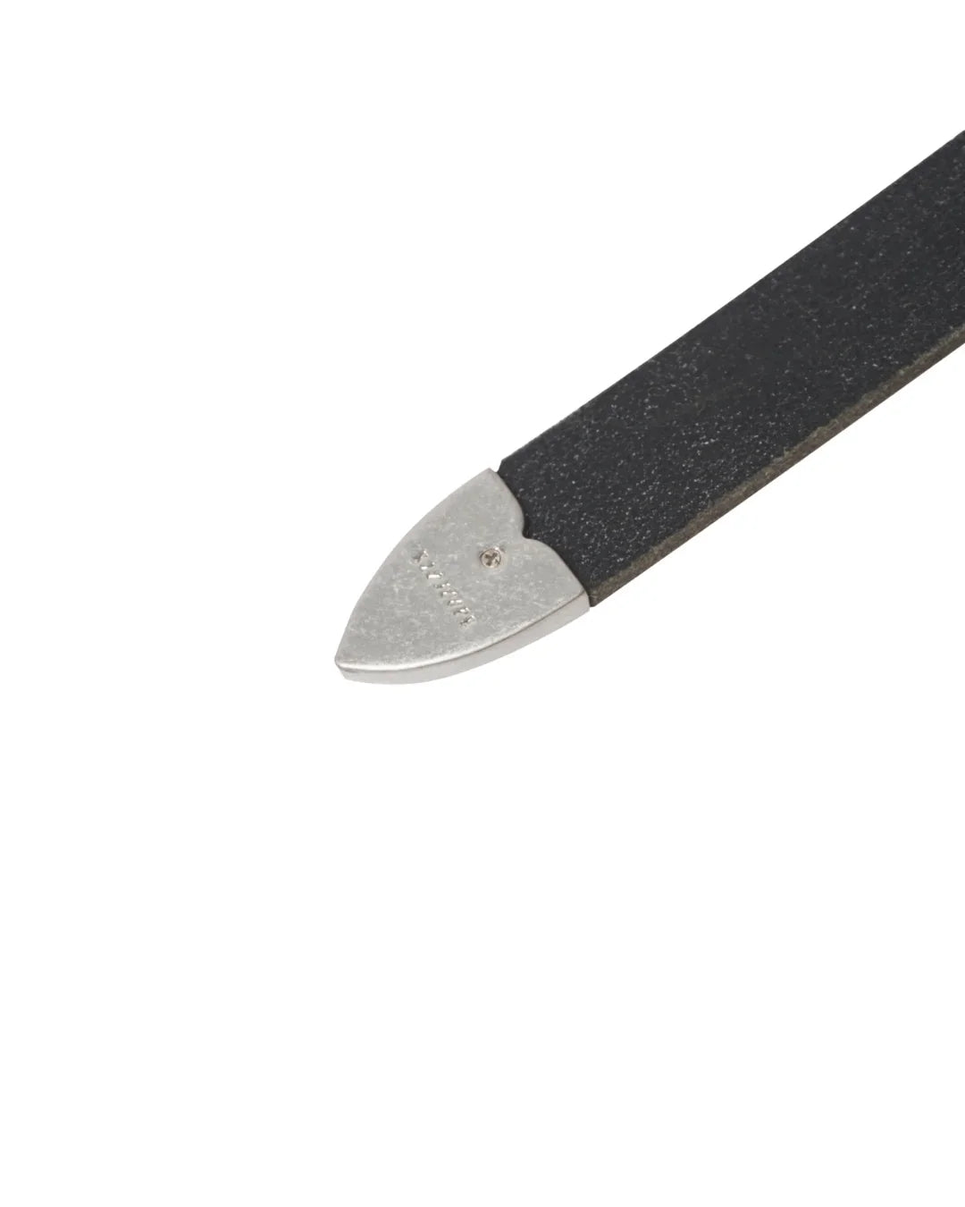 Image of a stylish black leather Western belt's metallic tips close up, placed on a white surface.
