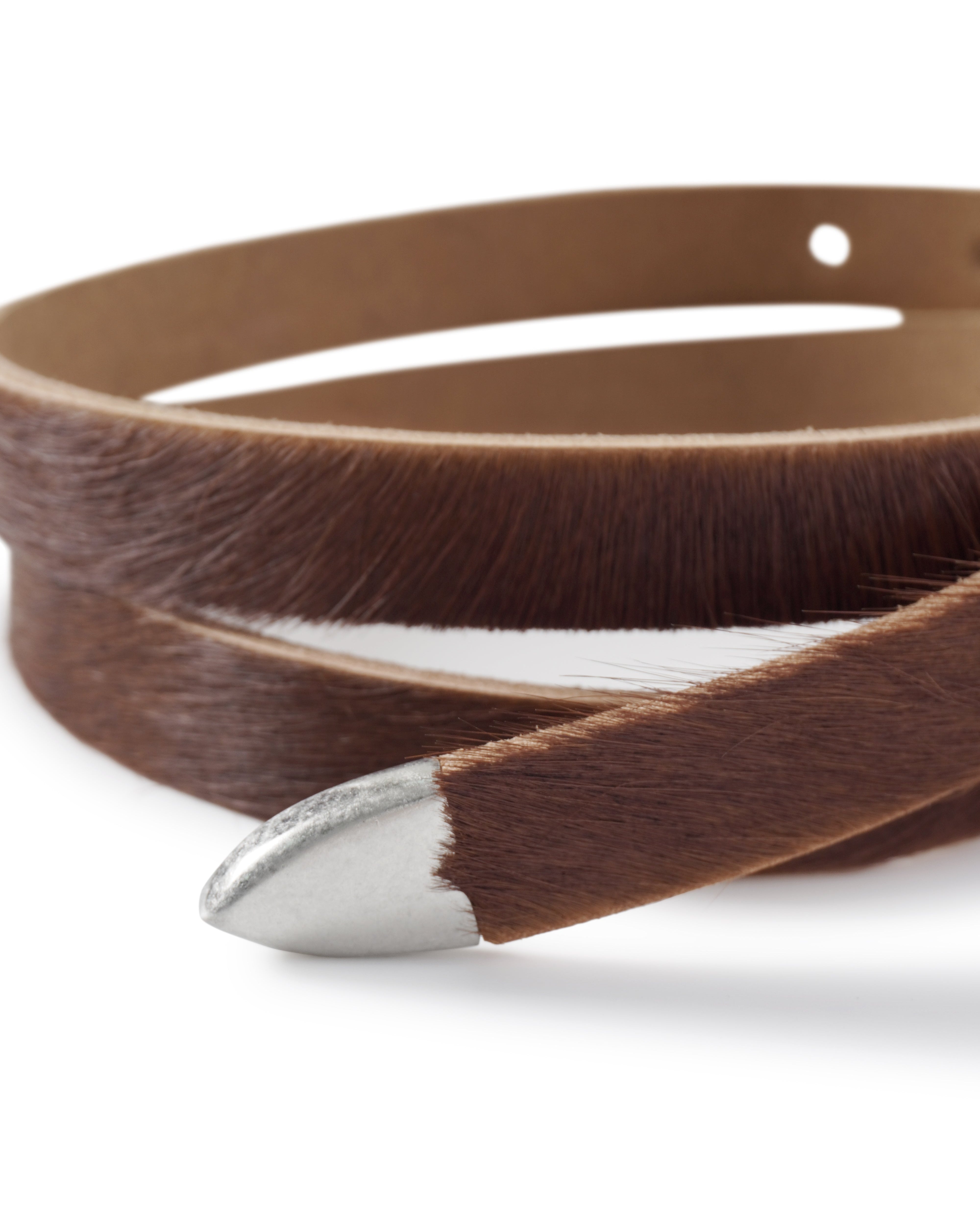 Brown leather belt with silver buckle on a white background