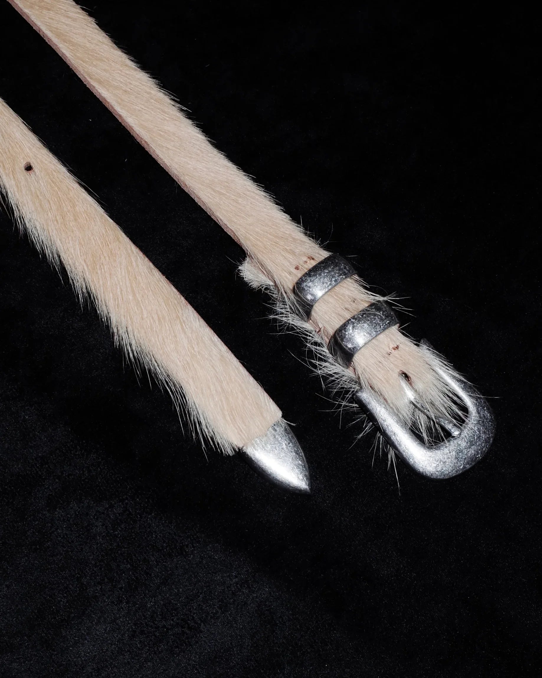 Cowhide Western belt with black background