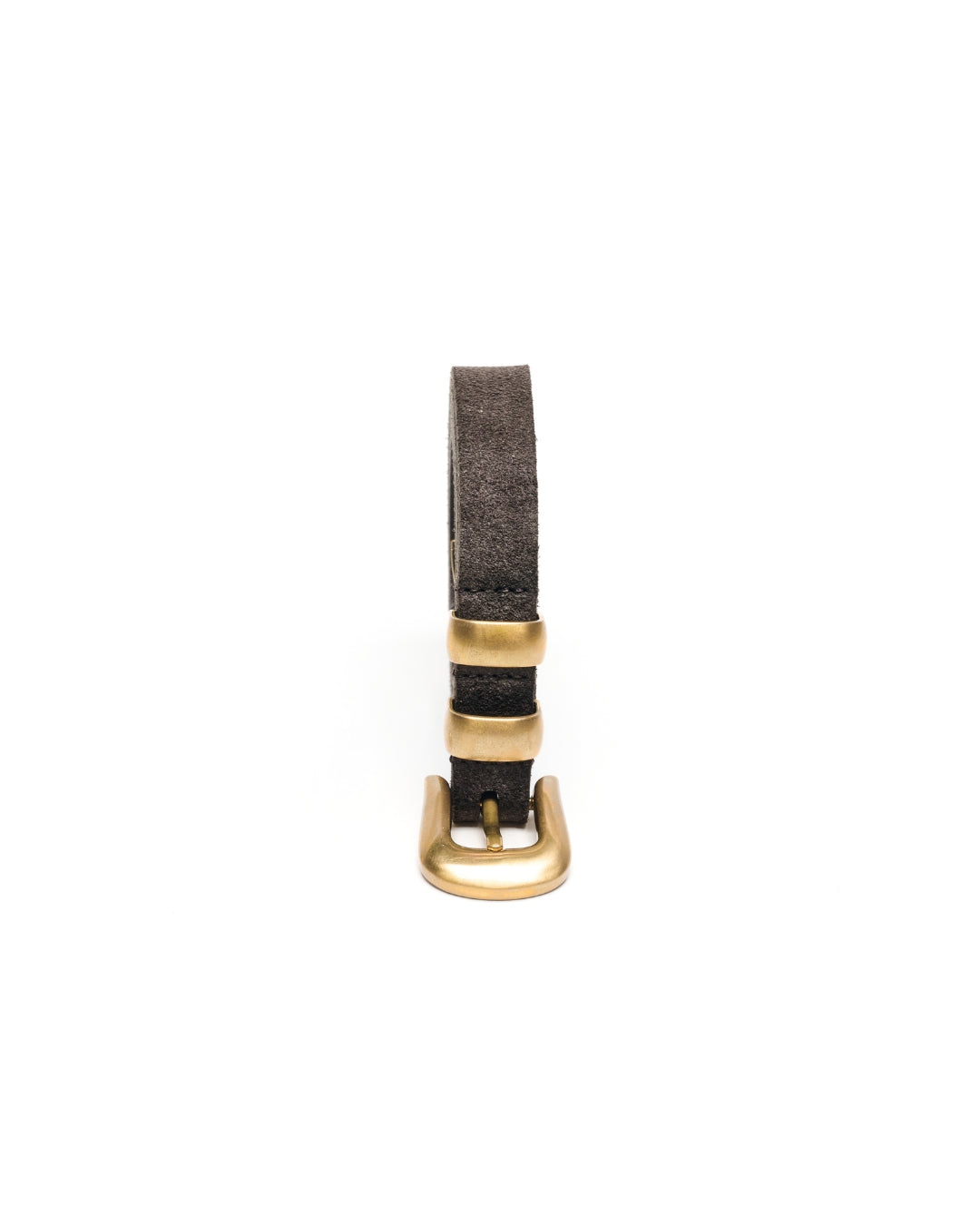 A charcoal brown suede leather Western belt strap with a polished gold-tone unlacquered solid brass buckle, shown vertically on a plain white background.
