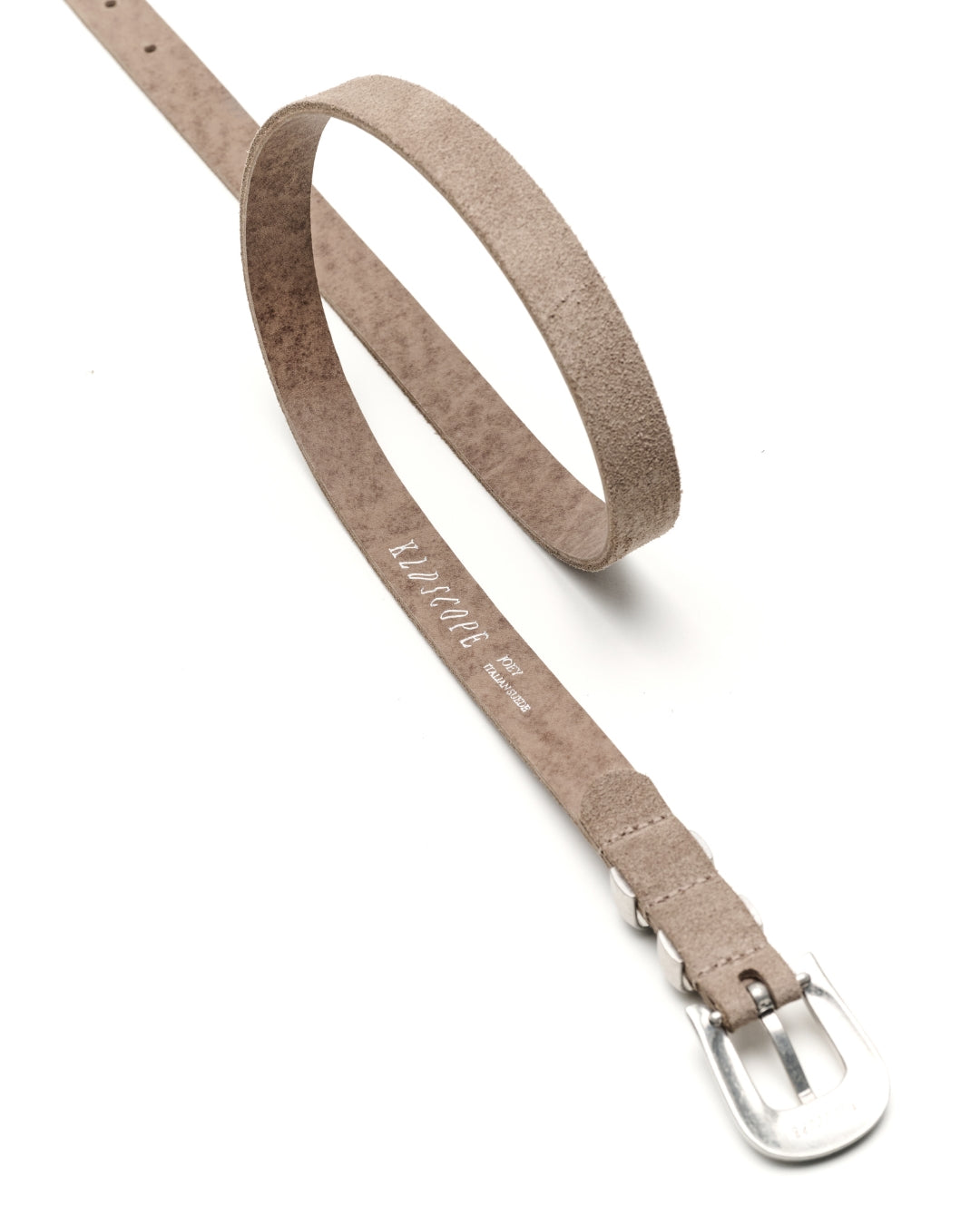 A sand-grey suede belt with a silver buckle, shown on a clean white background. The brand name 'KLDSCOPE' is printed on the strap.