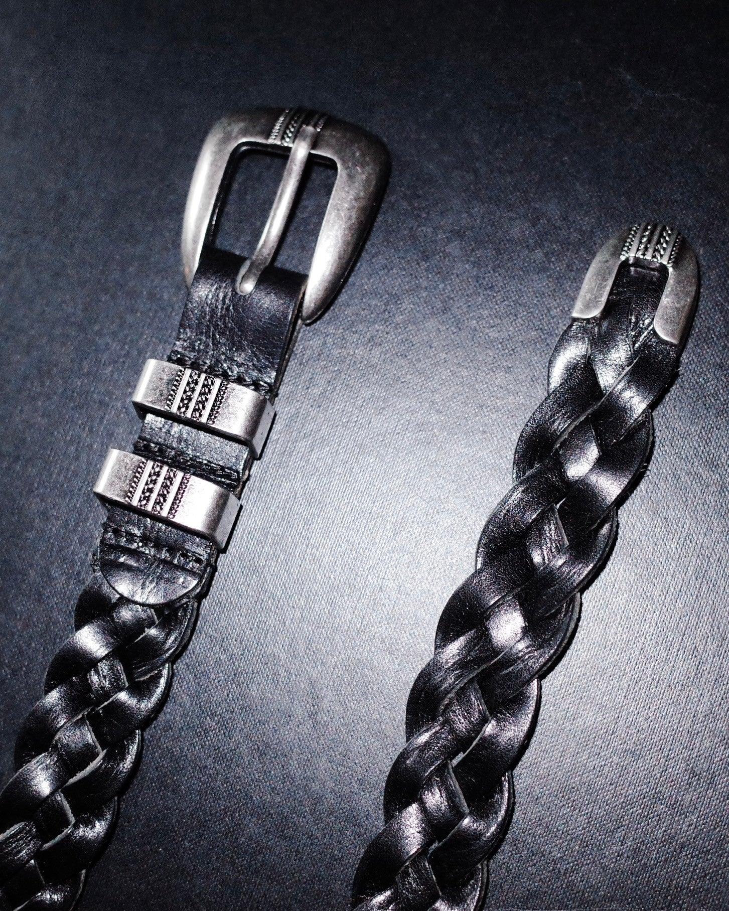 Deep black matte Western belt by KLDSCOPE with braided leather, Johnny belt buckle, and detailed tip, laid flat, a durable men’s fashion accessory, shop now.