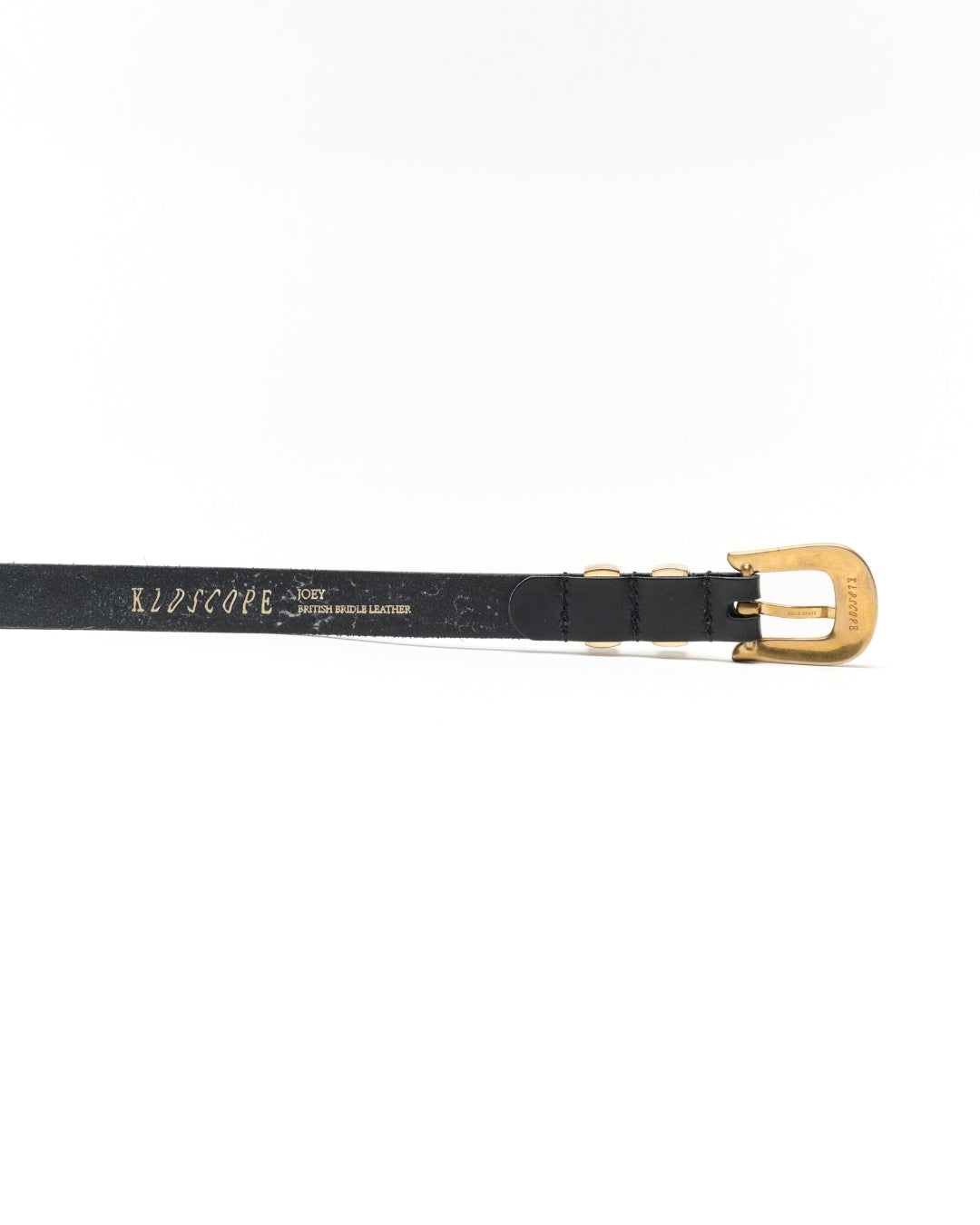 Reverse of the KLDSCOPE JOEY Classic Black belt showing British bridle leather markings, stitching and solid brass buckle.