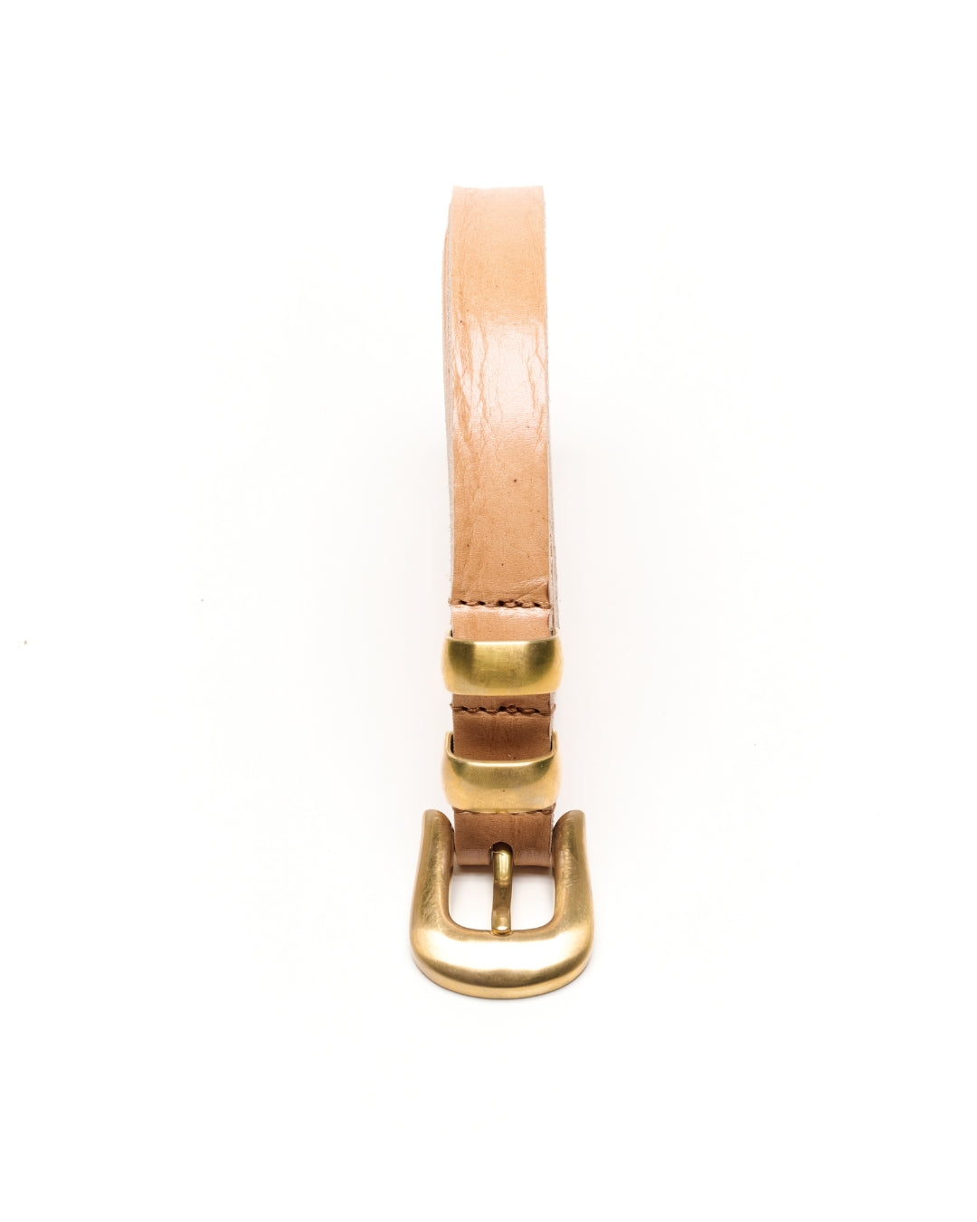 A light tan leather Western belt with a polished gold-tone metal buckle and keeper loops, shown on a clean white background.